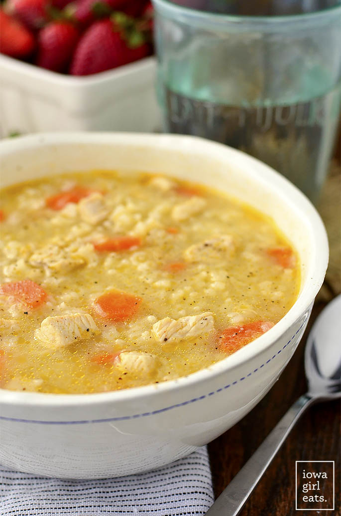 Easy Chicken and Rice Soup is a quick and easy gluten-free soup recipe that the entire family will love. Healthy comfort food in a bowl! | iowagirleats.com