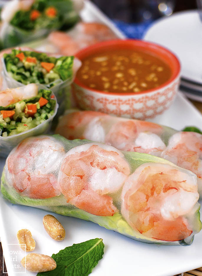 Fresh Summer Rolls with Spicy Peanut Dipping Sauce are light, crunchy, and healthy, and paired with a craveable yet easy dipping sauce! | iowagirleats.com