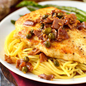 luscious company chicken with pan sauce over pasta