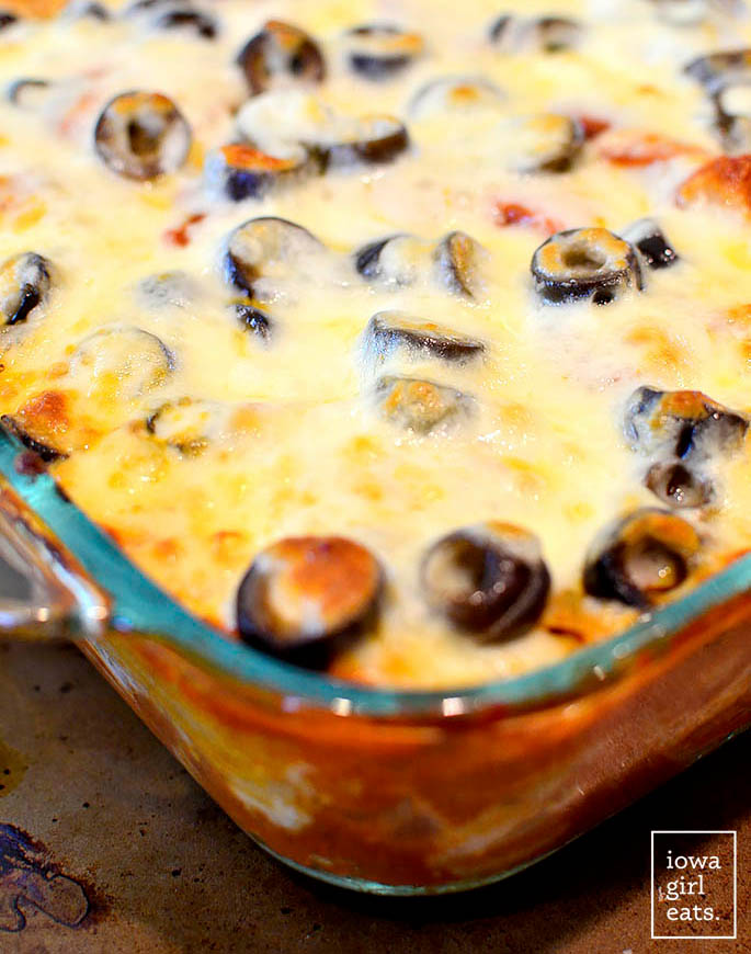 hot and cheesy pizza pasta bake in a casserole dish