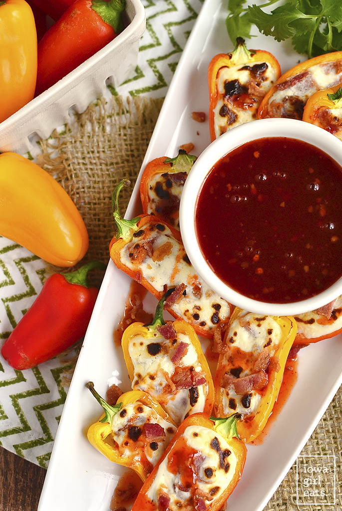 Bacon and Goat Cheese Stuffed Sweet Pepper Poppers are an addicting, gluten-free appetizer recipe. Less than 20 minutes to assemble and cook, and perfect for parties and get-togethers. | iowagirleats.com