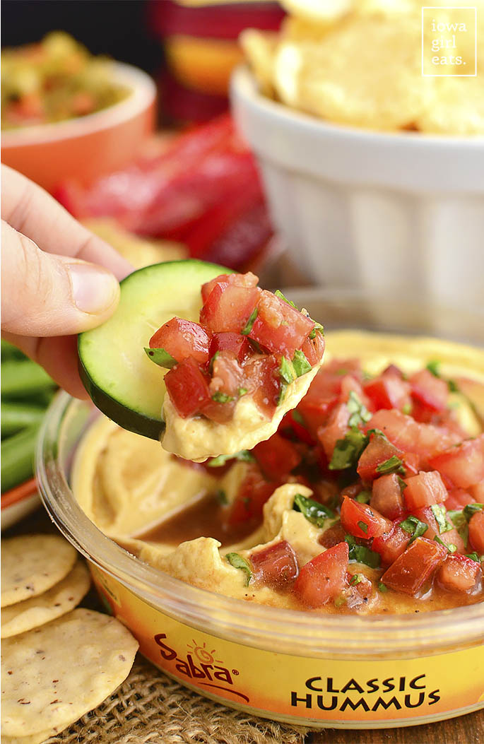 Bruschetta Hummus is a quick and easy way to jazz up store-bought hummus. Fresh, healthy, and absolutely delicious! | iowagirleats.com