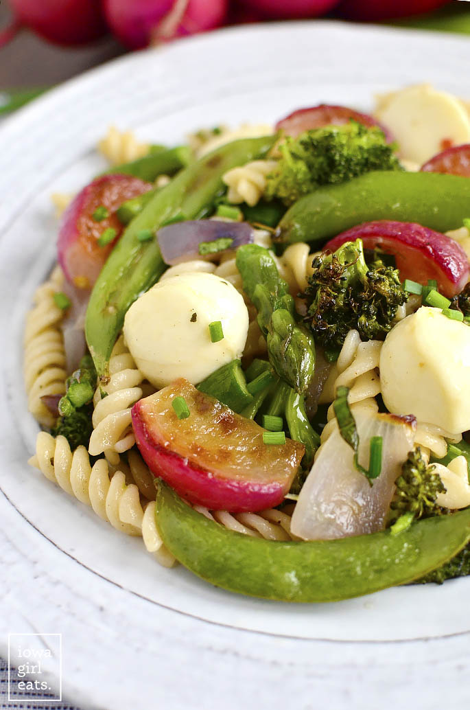Pasta with Roasted Spring Vegetables and Marinated Mozzarella is a light and healthy, gluten-free main featuring fresh spring vegetables, and decadent marinated mozzarella balls. | iowagirleats.com