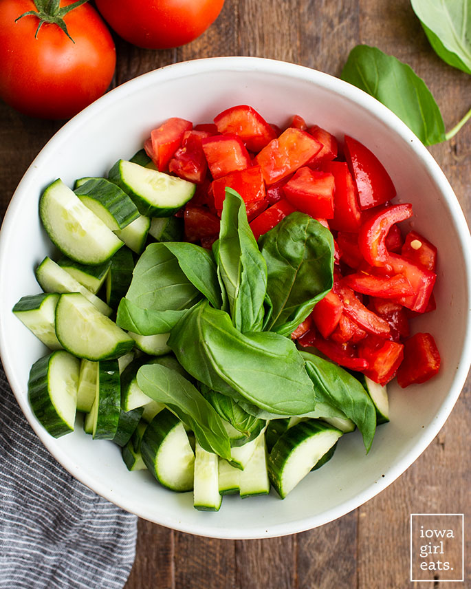 fresh vegetables and basil in a bowl