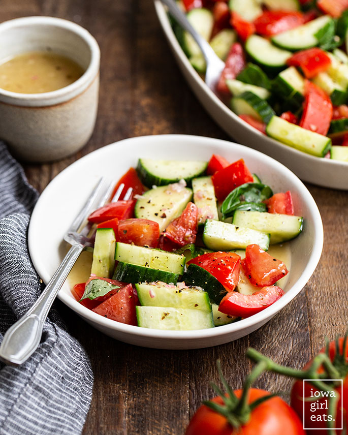 bowl of cucumber tomato salad with a fork
