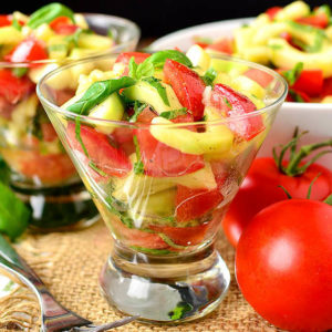 cucumber and tomato salad with italian vinaigrette in glasses