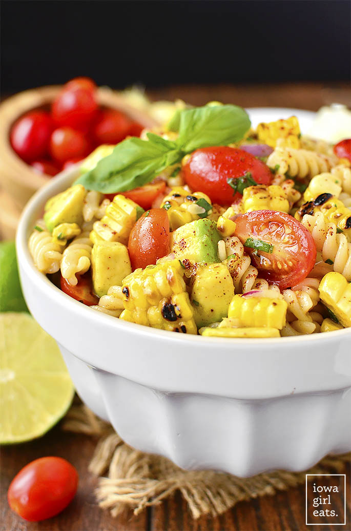 Grilled Corn and Avocado Pasta Salad with Chili-Lime Dressing is an easy, gluten-free pasta salad recipe full of color and fresh flavor! | iowagirleats.com