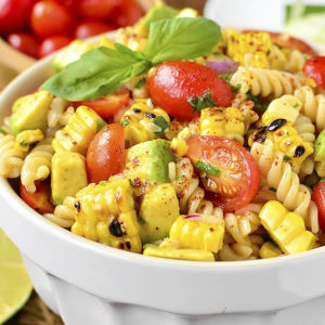 Grilled Corn and Avocado Pasta Salad with Chili-Lime Dressing is an easy, gluten-free pasta salad recipe full of color and fresh flavor! | iowagirleats.com
