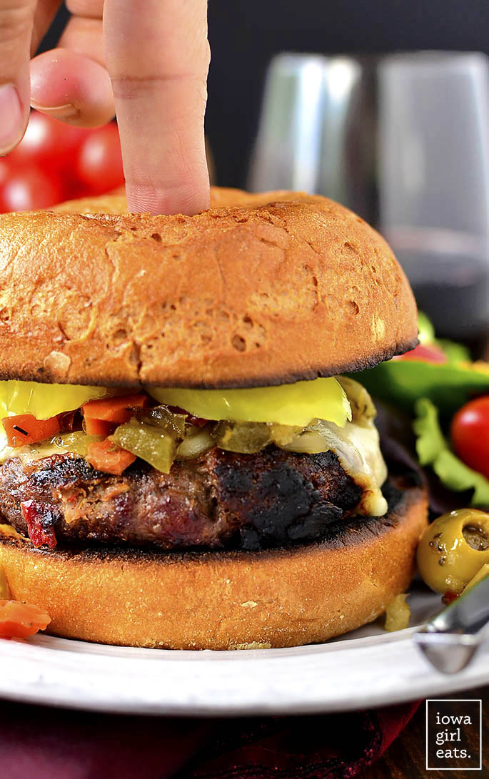 Chicago-Style Italian Burgers are a zesty, gluten-free grilling recipe packed with savory flavor. Grill indoors or out then top with melty cheese and tangy pickled peppers. | iowagirleats.com