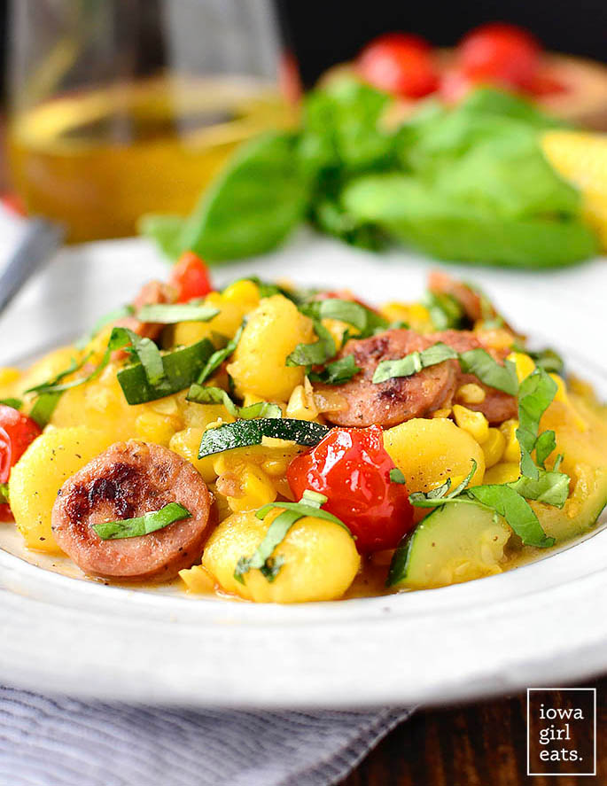 gnocchi, chicken sausage and vegetables on a plate
