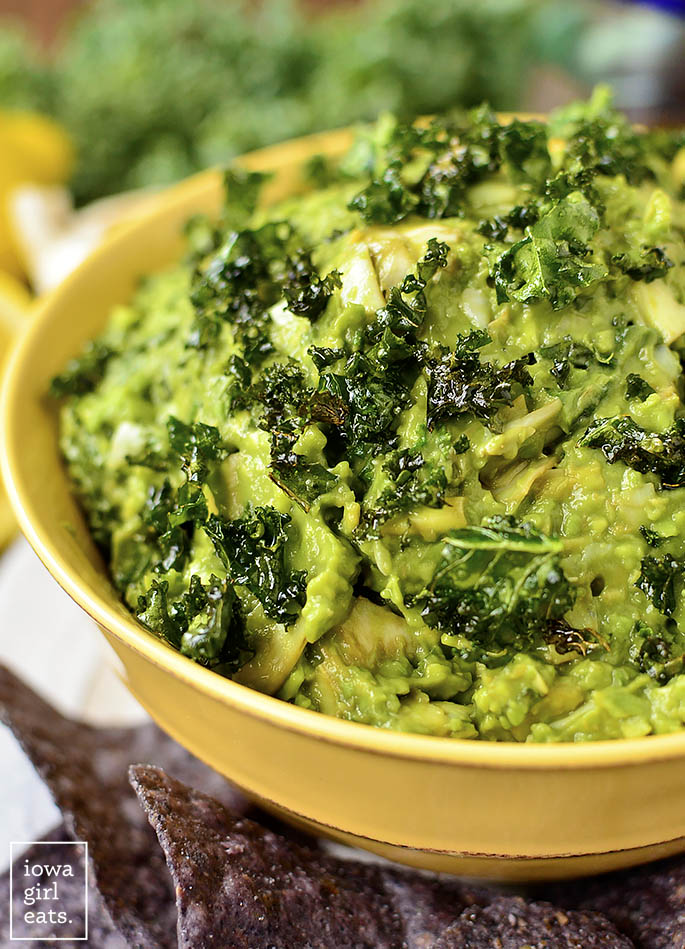 Kale and Artichoke Guacamole is a lighter twist on guacamole and spinach and artichoke dip, and is full of superfoods like kale and avocado. The perfect gluten-free + vegan dip recipe for any occasion! | iowagirleats.com