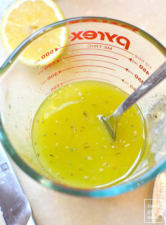 homemade lemon dressing in a measuring cup