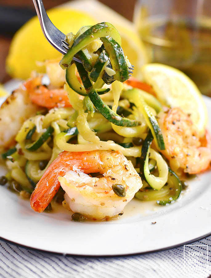 fork twirling zucchini noodles with shrimp