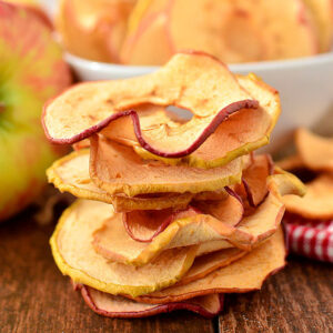 baked apple chips stacked on top of each other