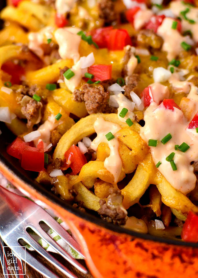 close up photo of crock pot cheeseburger french fries in a skillet