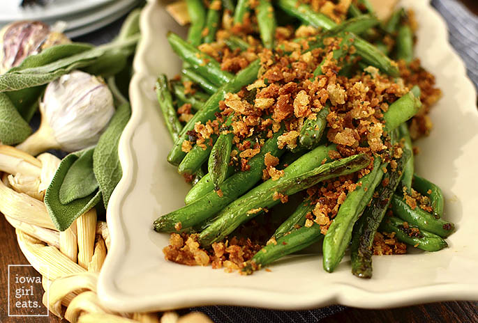 Green Beans with Brown Butter Garlic-Sage Breadcrumbs are made in 1 skillet and in 20 minutes. Serve as a beautiful and flavorful, gluten-free holiday side dish! | iowagirleats.com