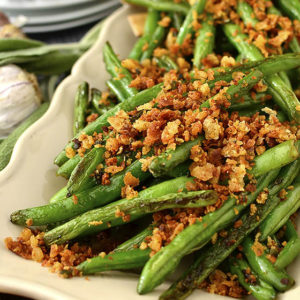 Green Beans with Brown Butter Garlic-Sage Breadcrumbs are made in 1 skillet and in 20 minutes. Serve as a beautiful and flavorful, gluten-free holiday side dish! | iowagirleats.com