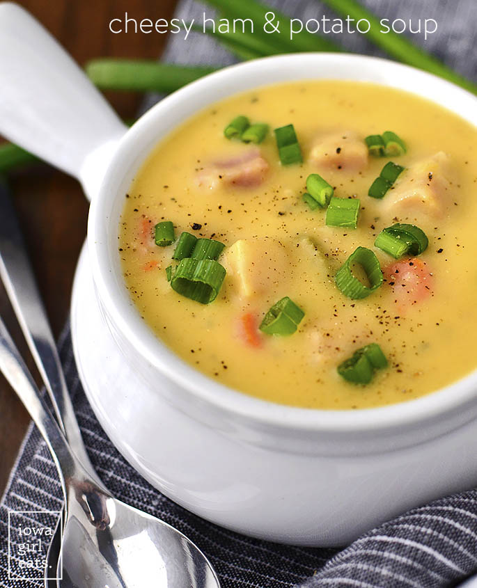 Cheesy Ham and Potato Soup is a thick and hearty gluten-free soup recipe that’s perfect for cold nights. Use leftover ham and mashed potatoes to make this simple soup even easier to whip up! | iowagirleats.com