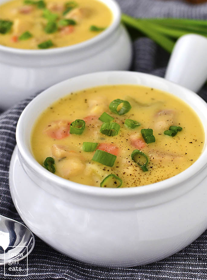 Cheesy Ham and Potato Soup is a thick and hearty gluten-free soup recipe that’s perfect for cold nights. Use leftover ham and mashed potatoes to make this simple soup even easier to whip up! | iowagirleats.com