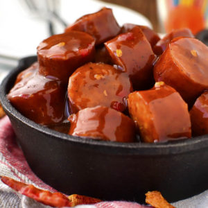 Crock Pot Sweet Chili BBQ Kielbasa is a 3 ingredient gluten-free appetizer recipe that couldn't be simpler. Perfect for parties and game day! | iowagirleats.com