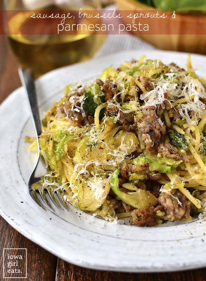 20 Minute Sausage, Brussels Sprouts and Parmesan Pasta will be on the table in absolutely no time. A filling and flavorful gluten-free dinner recipe! | iowagirleats.com