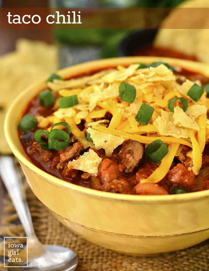Taco Chili is a fun way to change up taco night! Hot and hearty, this gluten-free chili recipe will be a favorite all year long. Make on the stovetop or in the crock pot! | iowagirleats.com