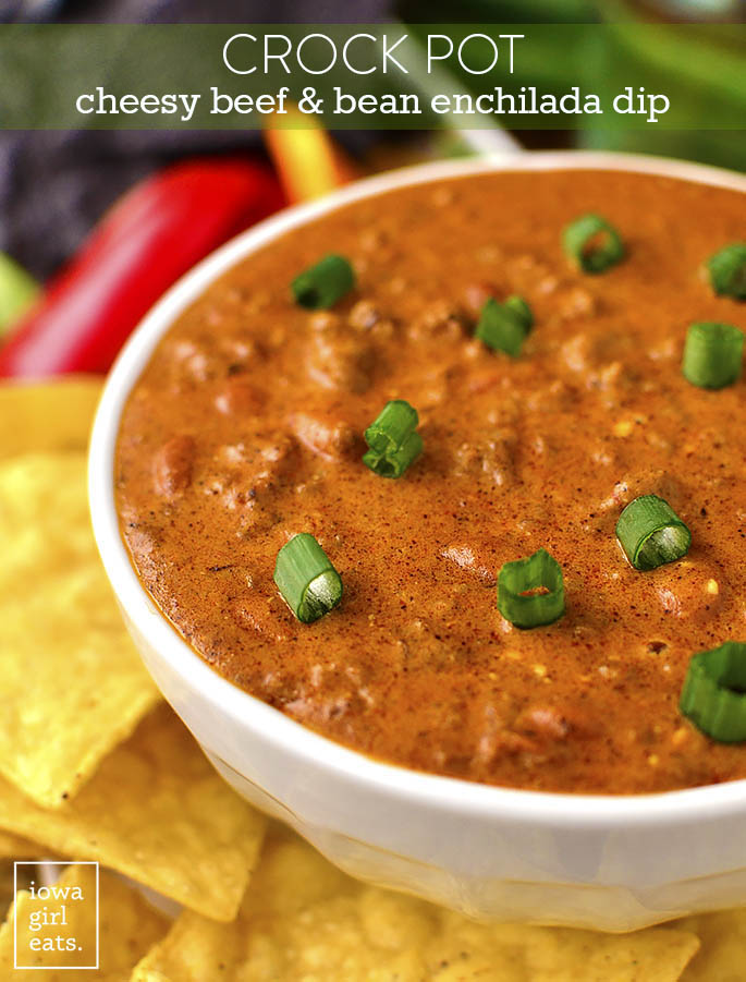 Crock Pot Cheesy Beef and Bean Enchilada Dip is a delectable gluten-free dip that's cheesy and savory. Perfect for game day or parties! | iowagirleats.com
