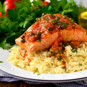 filet of salmon with provencal sauce over cooked white rice