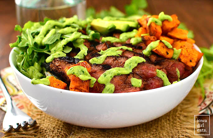 sliced steak and sweet potato bowls over rice