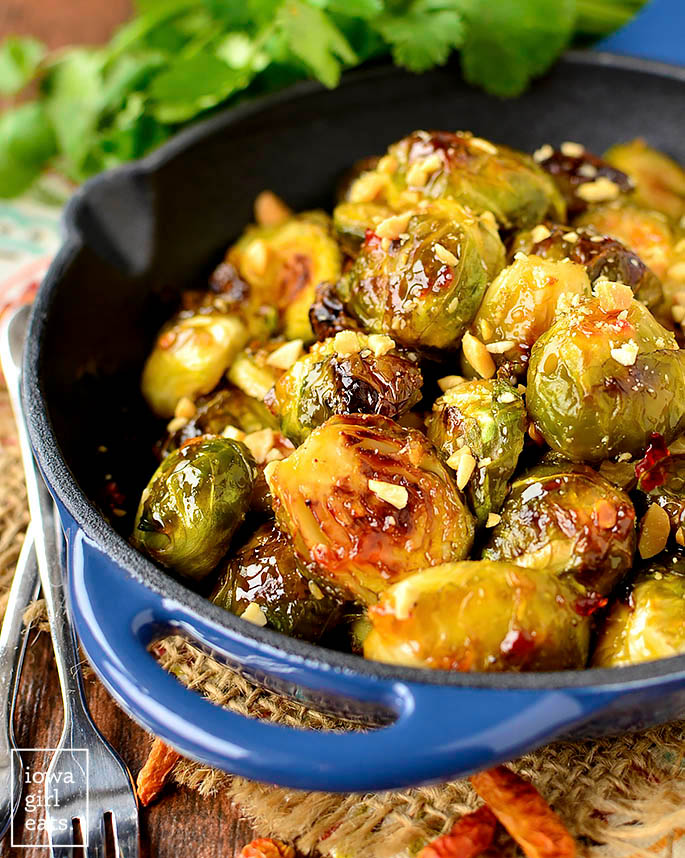 Sweet Chili Roasted Brussels Sprouts in a cast iron skillet