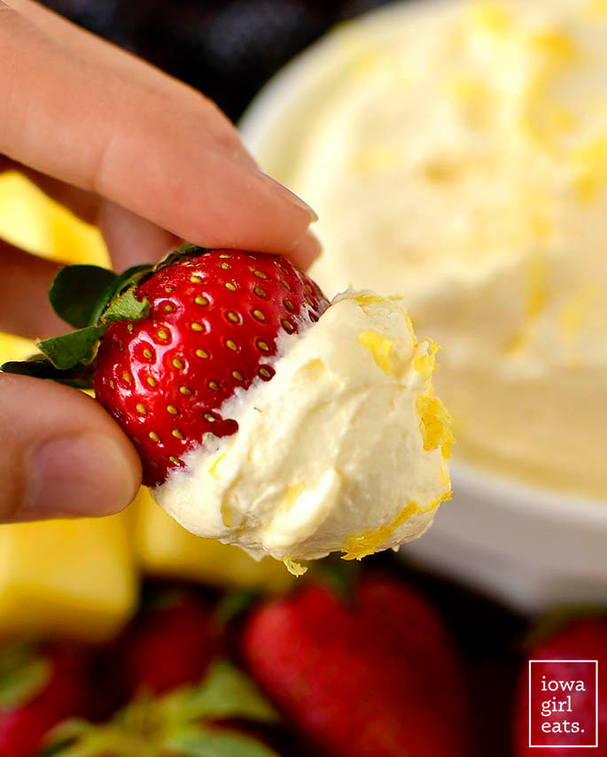 strawberry dipped into a bowl of lemon whip fruit dip