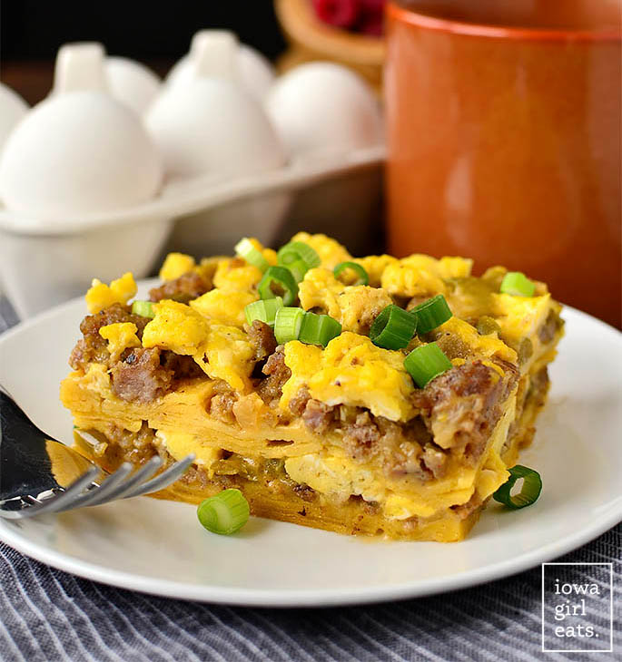 slice of breakfast taco casserole on a plate with a fork