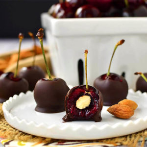 Almond-Stuffed Chocolate Covered Cherries is a simple, 3 ingredient, gluten-free dessert recipe that's ready in minutes! | iowagirleats.com