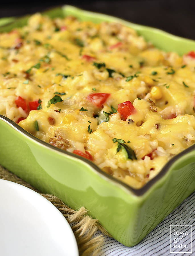 Cheesy Vegetable, Turkey Sausage and Rice Casserole is a home run! This healthy and filling, gluten-free casserole recipe is pure comfort food. | iowagirleats.com