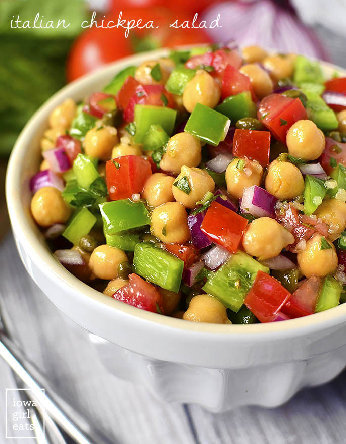 Italian Chickpea Salad is a simple, vegetarian salad recipe that's full of fresh and healthy ingredients. It's the perfect side dish for parties and potlucks! | iowagirleats.com