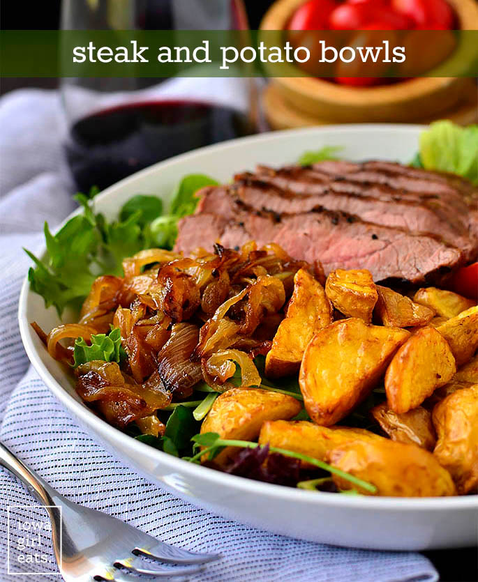 caramelized onions and potatoes on a steak salad