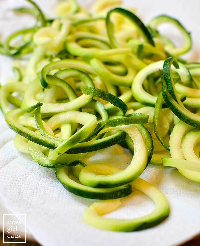 spiralized zucchini on a paper towel