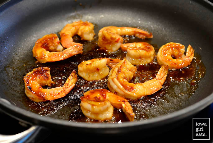 jumbo shrimp cooking in a skillet
