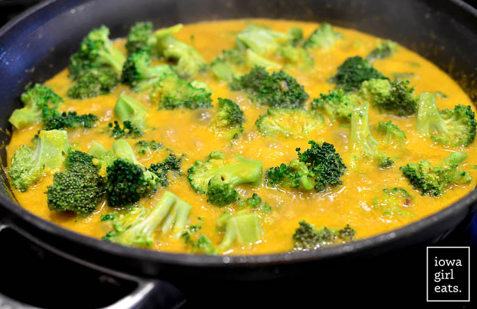 coconut chicken curry simmering in a skillet
