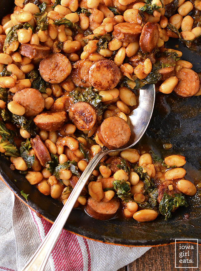 BBQ Sausage, Beans and Greens is an easy gluten-free dinner recipe that calls for just 7 ingredients, and is packed with protein, vitamins, and minerals. | iowagirleats.com