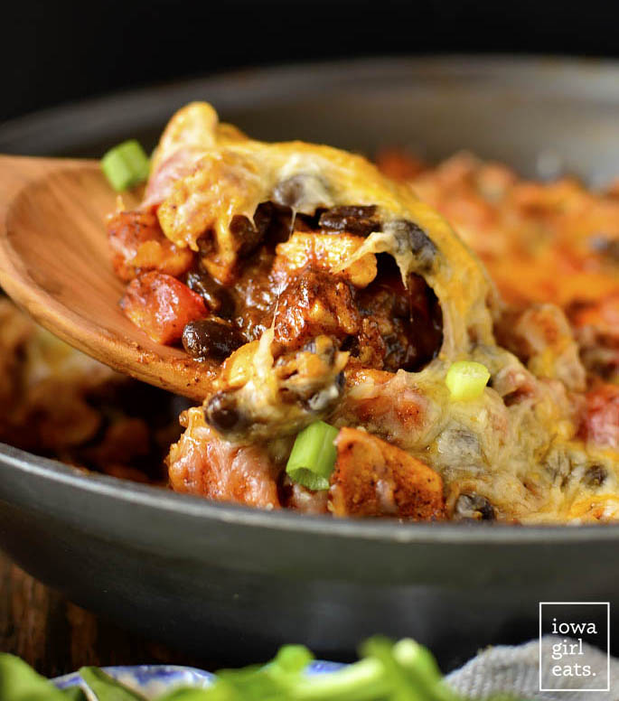 Black Bean and Sweet Potato Chicken Enchilada Skillet is a healthy, 1 skillet, gluten-free dinner recipe that my entire family (including my 4 year old!) described as "really, REALLY good!" | iowagirleats.com