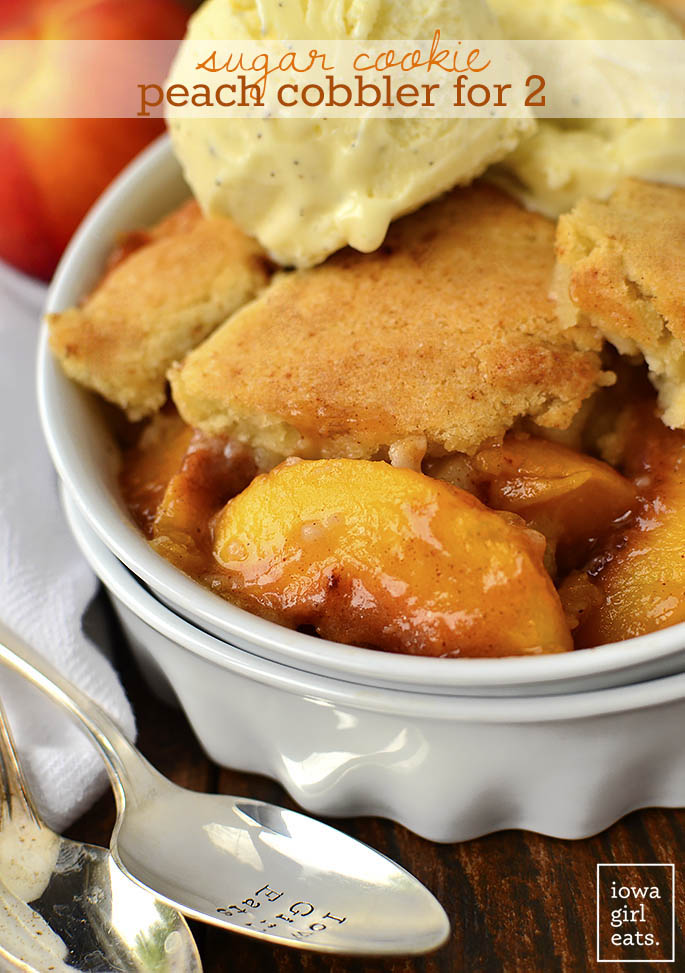 Sugar Cookie Peach Cobbler for Two is a cozy gluten-free dessert recipe that makes just enough for you and a friend. Made in just one bowl, it's a cinch to whip up! | iowagirleats.com
