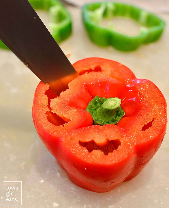 knife prepping a bell pepper for stuffed peppers