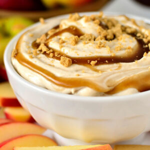caramel apple cheesecake dip with caramel and crushed graham crackers on top
