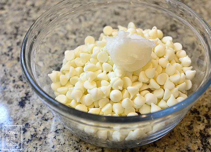 white chocolate chips in a bowl with coconut oil