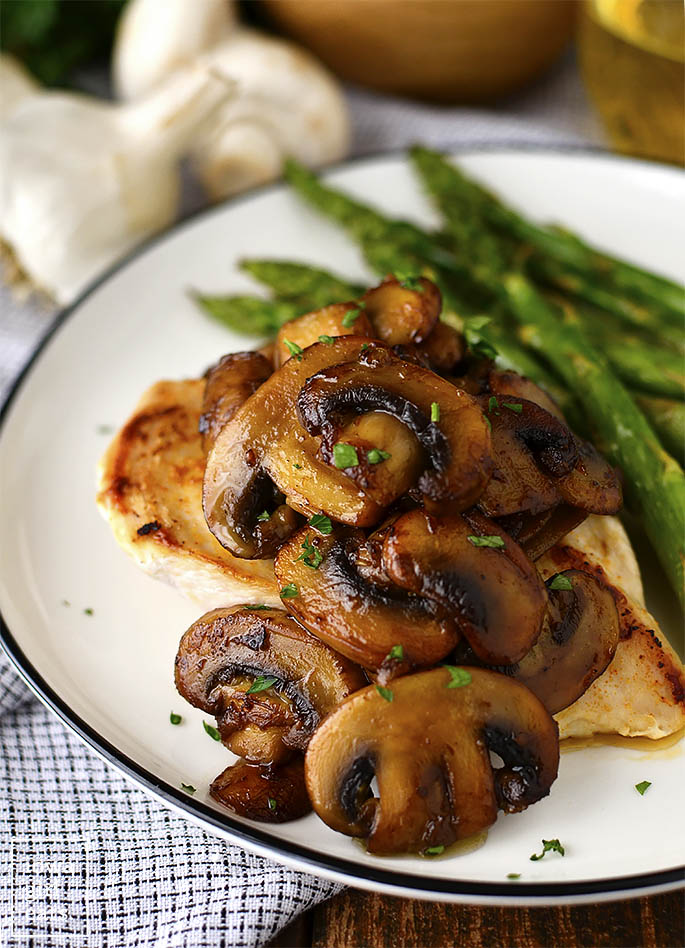 Garlic Butter Soy-Glazed Mushrooms is the easiest, most mouthwatering gluten-free side dish recipe I know! Serve with chicken, burgers, steak, or baked potatoes. | iowagirleats.com