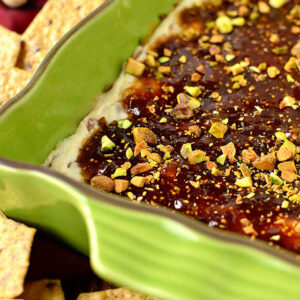 warm fig and prosciutto goat cheese dip in a baking dish