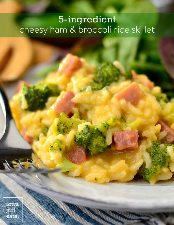 cheesy ham and broccoli rice on a plate with a fork