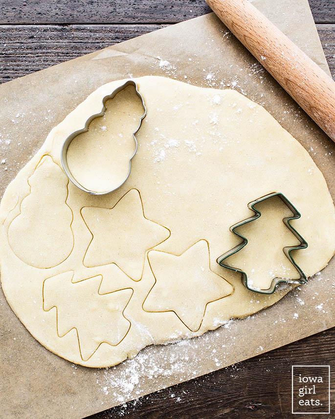 gluten free sugar cookie rolled out and cut into with cookie cutters