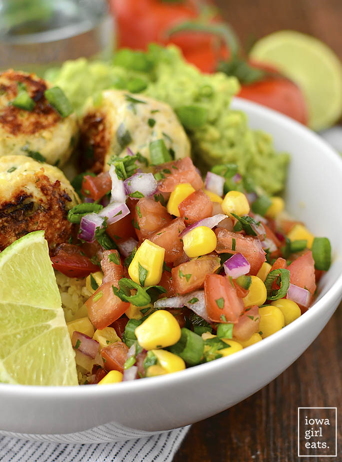 Cilantro-Lime Chicken Meatball Bowls with Sweet Corn Pico de Gallo and Cauli-Rice are a fresh and flavorful gluten-free lunch or dinner recipe. Prep once and enjoy all week long! | iowagirleats.com